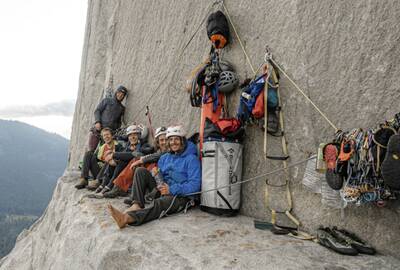 climbers using sea to summit packs up on a ledge